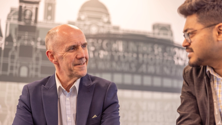 Neil Spencer and another man talking