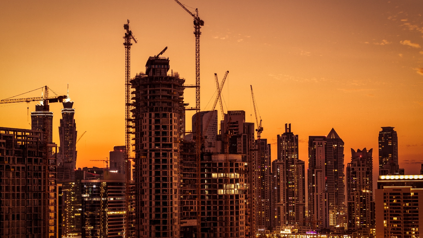 City construction site at sunset
