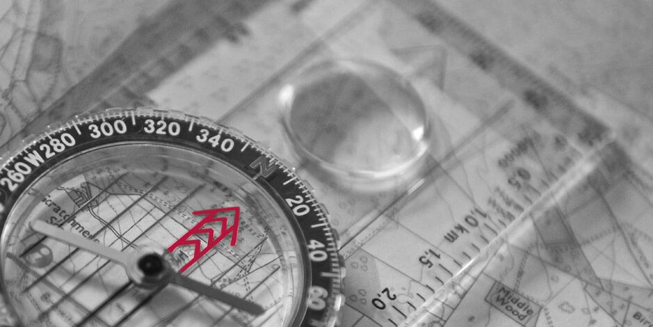 Compass laid over a map | Atradius